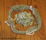 seeds and green spun cotton from 1 ounce fiber/seeds--plus spindle
